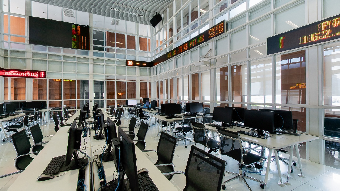 Financial laboratory with computer workstations and market ticker displays